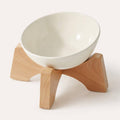 Elevated ceramic cat bowl with wooden stand in beige